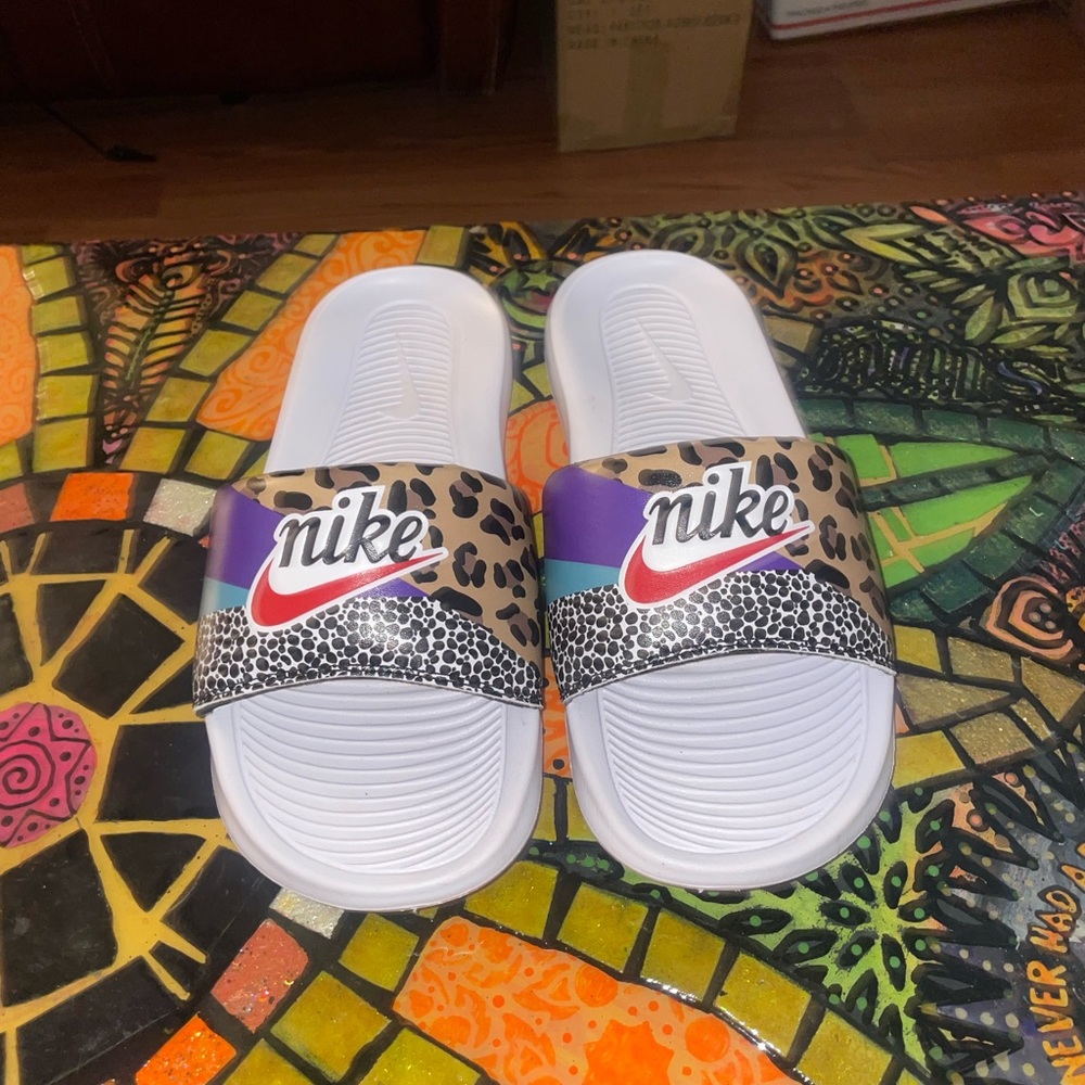 Colorful cheetah Nike slides